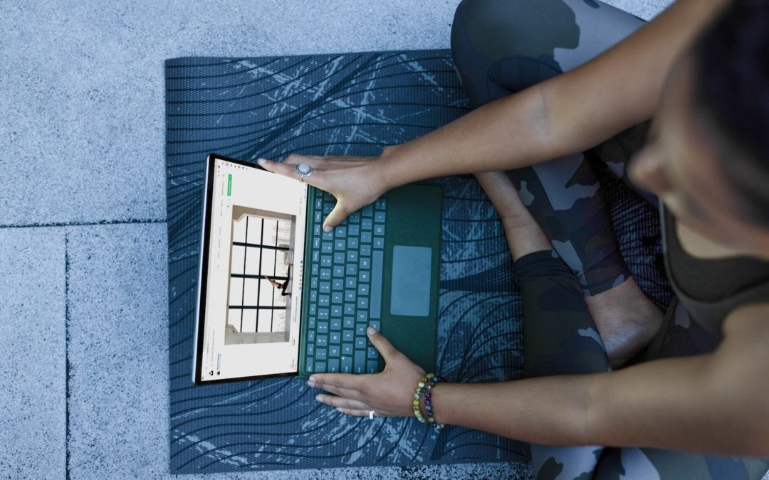 Passwörter a woman using a laptop computer on a mat password Passwort